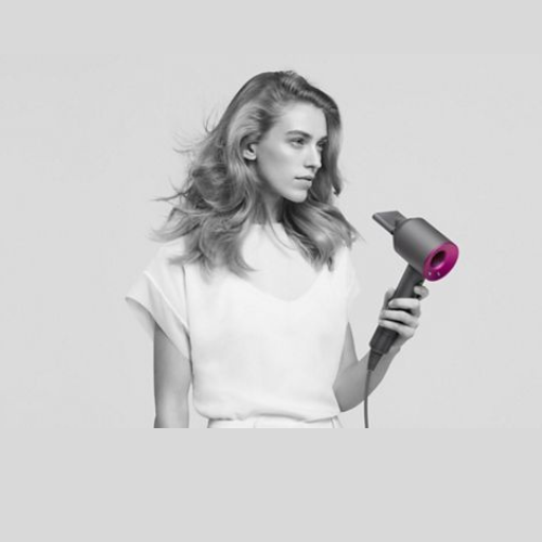 Refurbished Dyson Supersonic hair dryer in Iron/Fuchsia.